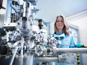 STFC’s Dr Emma Springate, one of the research team, with the Artemis laser (Credit: Monty Rakusen Photography)