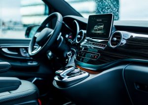 Luxury car interior details. Dashboard and steering wheel