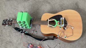 Arduino guitar device plays Wonderwall