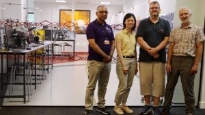 ASISST project team next to industrial standard teaching clean room at the University of Sheffield l2r Dr Raja Toqeer, Prof Jo Shien Ng, Dr Ian Farrer, Dr Gavin Williams