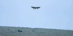 Uncrewed air and land vehicles in tandem